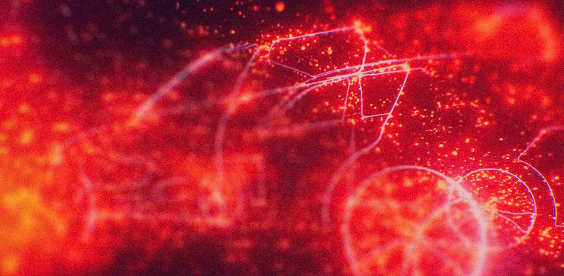 A cloud of red particles draws the outline of a jaguar vehicle.